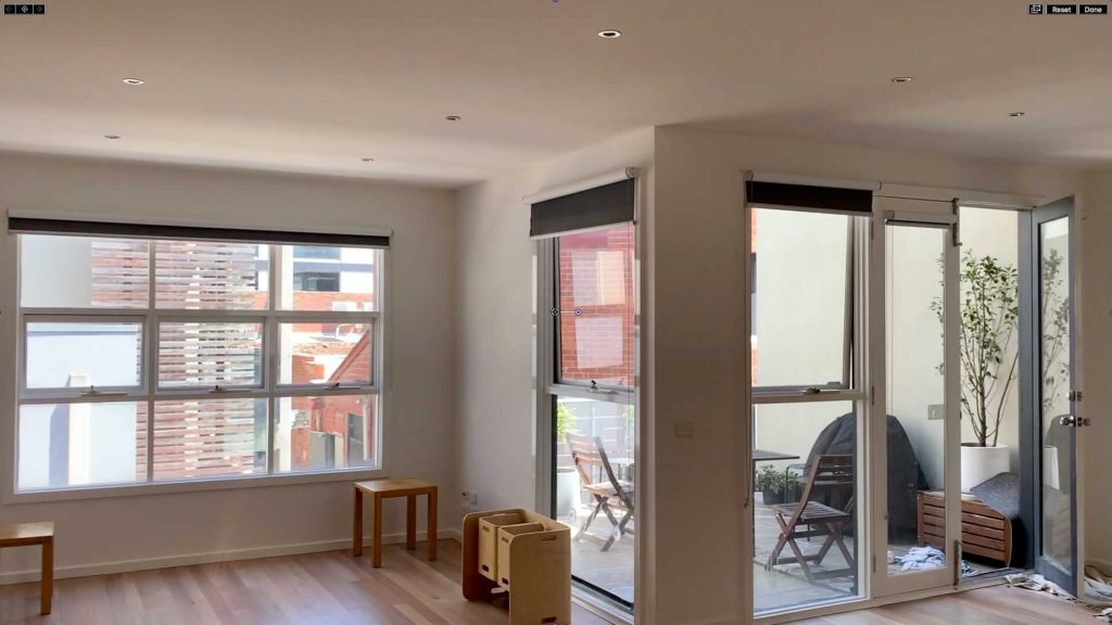 Living area with freshly painted white walls and ceiling after an interior repaint by Melbourne City Maintenance