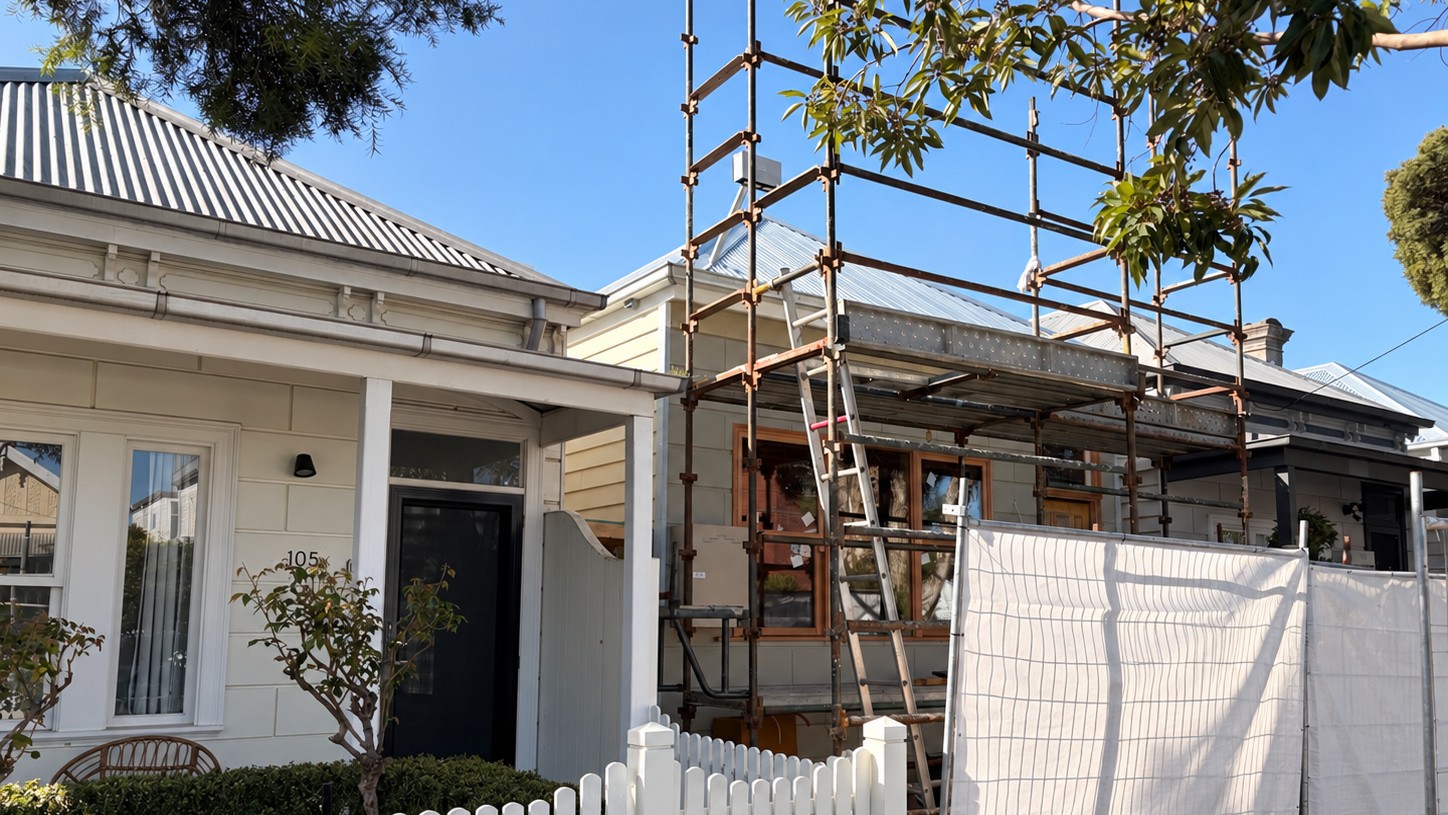 Scaffolding erected across the front of a weatherboard home in Richmond, giving Melbourne City Maintenance access to the eaves and gutter line for exterior preparation